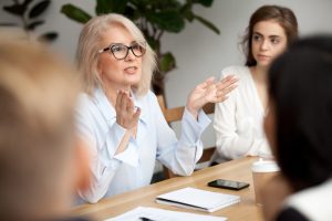 Woman having discussion with team